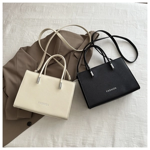 Minimalist faux leather tote bag in black and white with silver Fashion print