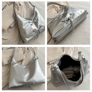 Detail view of silver metallic hobo bag with bow tie and chain strap in multiple angles