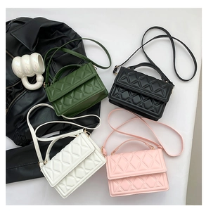 Top view of quilted crossbody flap bags in green, black, white, and pink leather finish