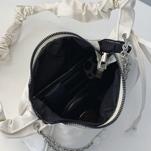 White ruched cloud handbag with pearl and metal chain straps showing spacious interior