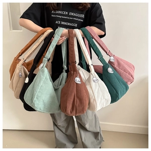 Detailed collection of corduroy crossbody bags in eight colors with cute dog charms