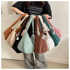 Collection of multi-color corduroy tote bags with cute cloud charms in various earthy tones