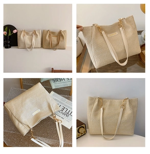 Detail of woven straw tote bag featuring gold chain handle and metal Fashion logo