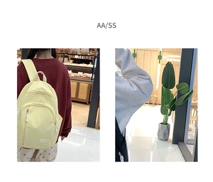 Duale Ansicht eines hellgelben Nylon-Schulrucksacks mit Multi-Pocket-Design und breiten Gurten