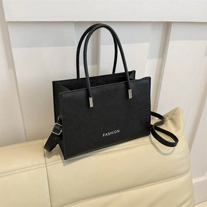 Chic black litchi pattern leather tote bag with silver Fashion lettering and shoulder strap