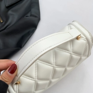 White quilted crossbody bag with gold hardware and elegant minimalist square design