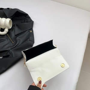 Minimalist white leather rectangular crossbody bag with golden magnetic buckles