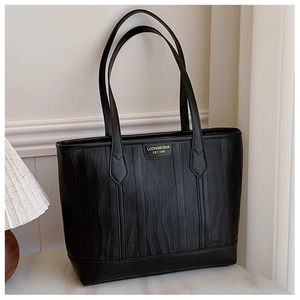 Detail of black tote bag featuring wavy texture fabric and gold Luonimeisha logo
