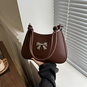 Retro dark brown leather underarm bag with silver metal bow and knotted rope strap