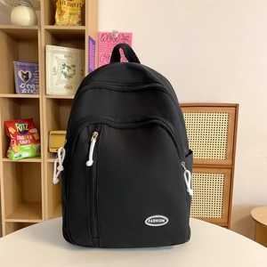 Großer schwarzer wasserfester Nylon-Rucksack für Schüler mit modischem Logo-Detail