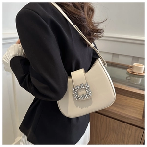 Elegant cream white PU leather baguette bag with shimmering rhinestone buckle detail