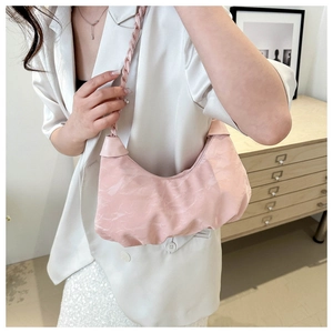 Chic light pink hobo underarm bag with marble texture and braided strap on shoulder