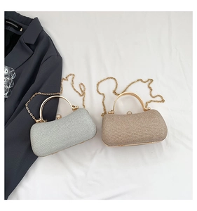 Detail of glitter evening clutch bags with gold metal handles and diamond clasp closures