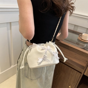 White pleated bucket bag with satin bows and metal chain strap for women