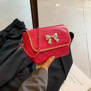 Fashionable rose red quilted crossbody bag with silver metal bow and chain strap