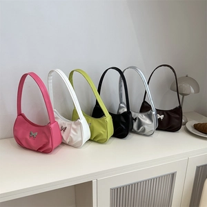 Minimalist Hobo shoulder bag with metallic butterfly hardware in six vibrant colors