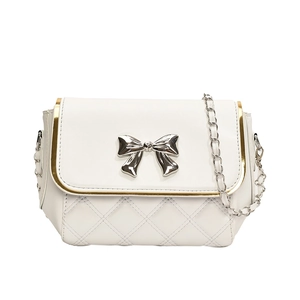 White quilted crossbody bag with gold piping and silver bow lock, minimalist front view