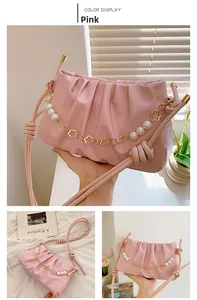 Pink pleated faux leather shoulder bag featuring pearl and gold floral chain detailing
