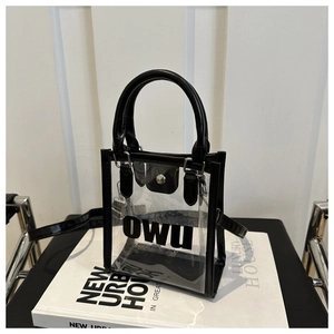 Sac à main en PVC transparent avec bordure noire en similicuir et logo OWU sur livre