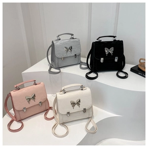 Multi-purpose women's backpack with metallic butterfly in black, white, pink and grey
