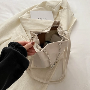 Minimalist beige leather bucket backpack with chain strap and large capacity