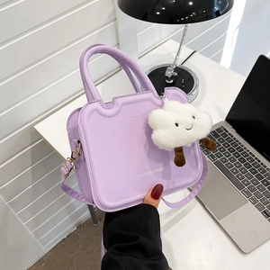 Lavender purple fashion crossbody bag featuring a plush white cloud charm and branding