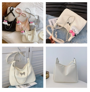 Detail view of stylish hobo bags in four colors with bow metal buckle and rabbit charm