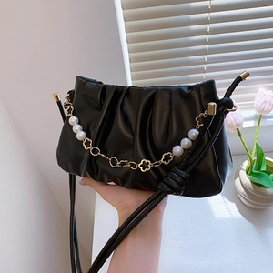 Fashionable black pleated cloud handbag with elegant pearl and gold flower chain strap