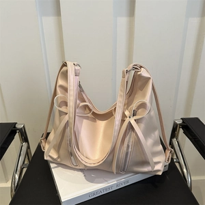 Sac à dos tote beige pour femme avec nœud décoratif et détail de fermeture éclair