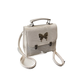 Chic beige backpack for women featuring texture leather and butterfly metal buckle