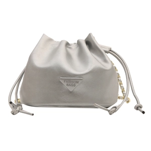Silver drawstring bucket bag with metallic triangle logo and chain strap for women