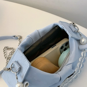 Light blue pleated shoulder bag with pearl trim and silver chain for daily essentials