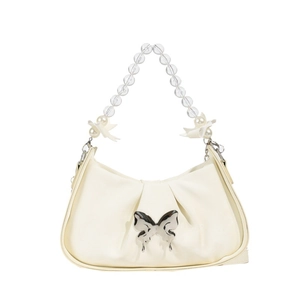 Chic cream bow shoulder bag with beaded chain strap and silver butterfly accent