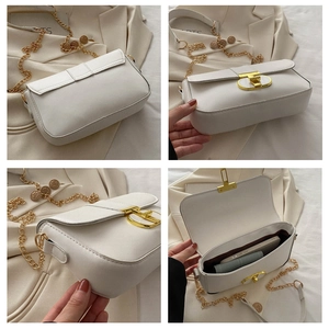 Multiple views of a white leather crossbody bag with gold chain and interior storage space