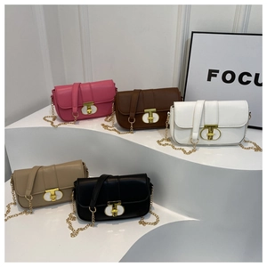 Chic leather chain crossbody bags in pink, brown, white, khaki, and black on a white stand