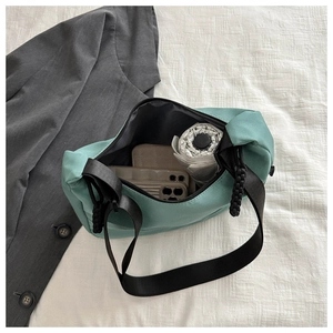 Interior view of mint green tote showing large capacity with phone and umbrella
