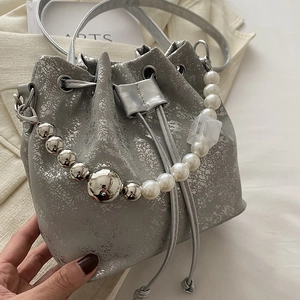Silver bucket bag with cracked texture, drawstring closure and pearl metal chain handle