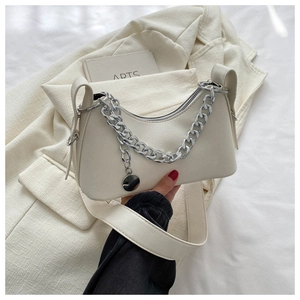 Detail of cream crescent hobo bag with silver chunky chain and smooth faux leather