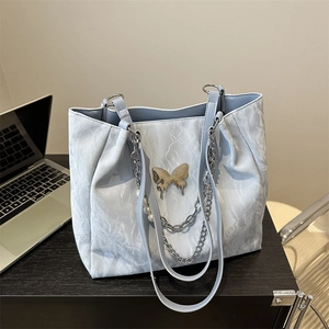 Minimalist large capacity tote bag with silver crinkle texture and gold butterfly charm