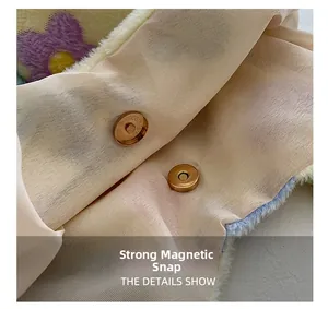 Detail of plush tote bag interior with magnetic closure and purple floral pattern