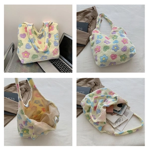 Detail view of large plush tote bag with colorful hearts showing spacious interior storage