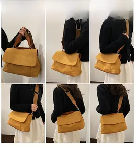 Sac bandoulière en daim jaune gingembre avec large sangle et différents styles de portage