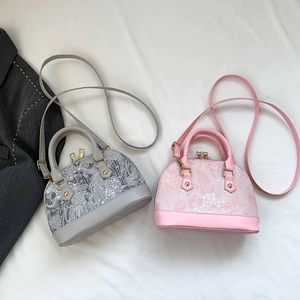 Top-down view showing gray and pink shell bags with intricate embroidery and PU leather straps