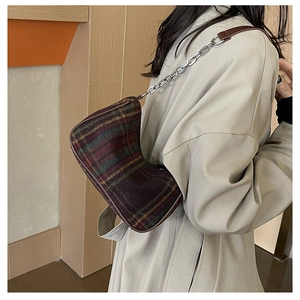 Classic tartan underarm bag featuring vintage plaid fabric and silver chain leather strap
