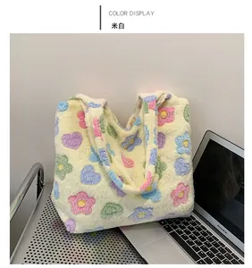 Detail shot of plush tote bag showing soft beige fleece and colorful flower patterns