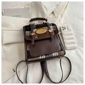 Detailed view of mini contrast backpack in dark brown faux leather and tweed fabric