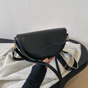 Classic black leather saddle bag with contrast wide strap and gold hardware accents