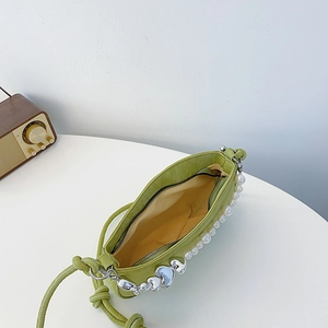 Avocado green leather shoulder bag with white pearl chain and silver heart detail
