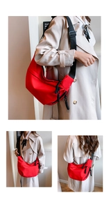 Detailed views of red nylon crescent crossbody bag with adjustable black strap on a model