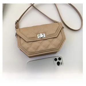Size comparison of a khaki quilted crossbody bag shown next to a smartphone